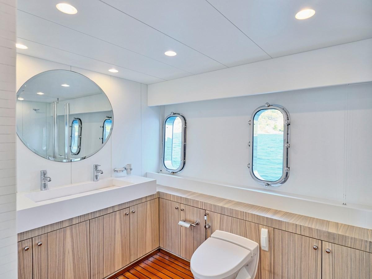 a bathroom with a large mirror aboard BOOBALE Yacht for Sale