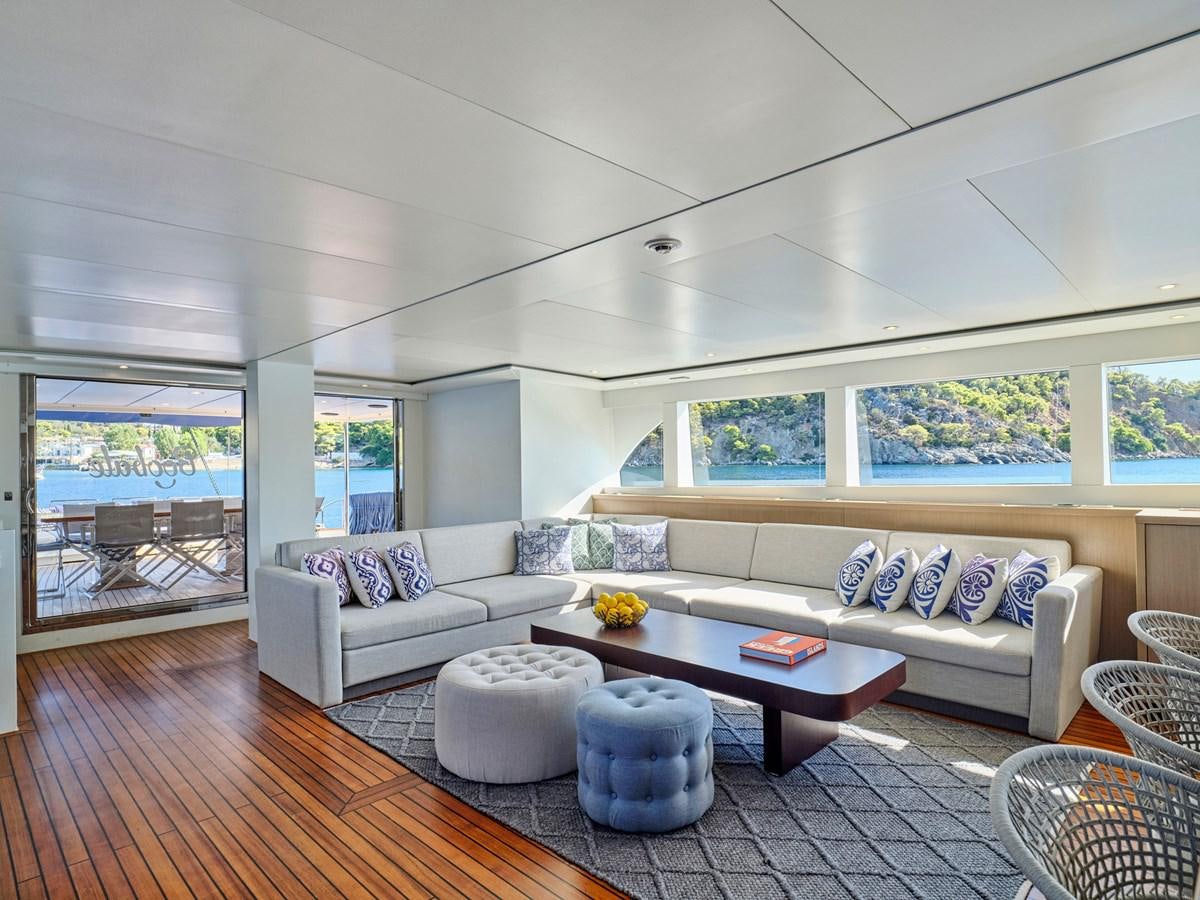 a living room with a large window aboard BOOBALE Yacht for Sale