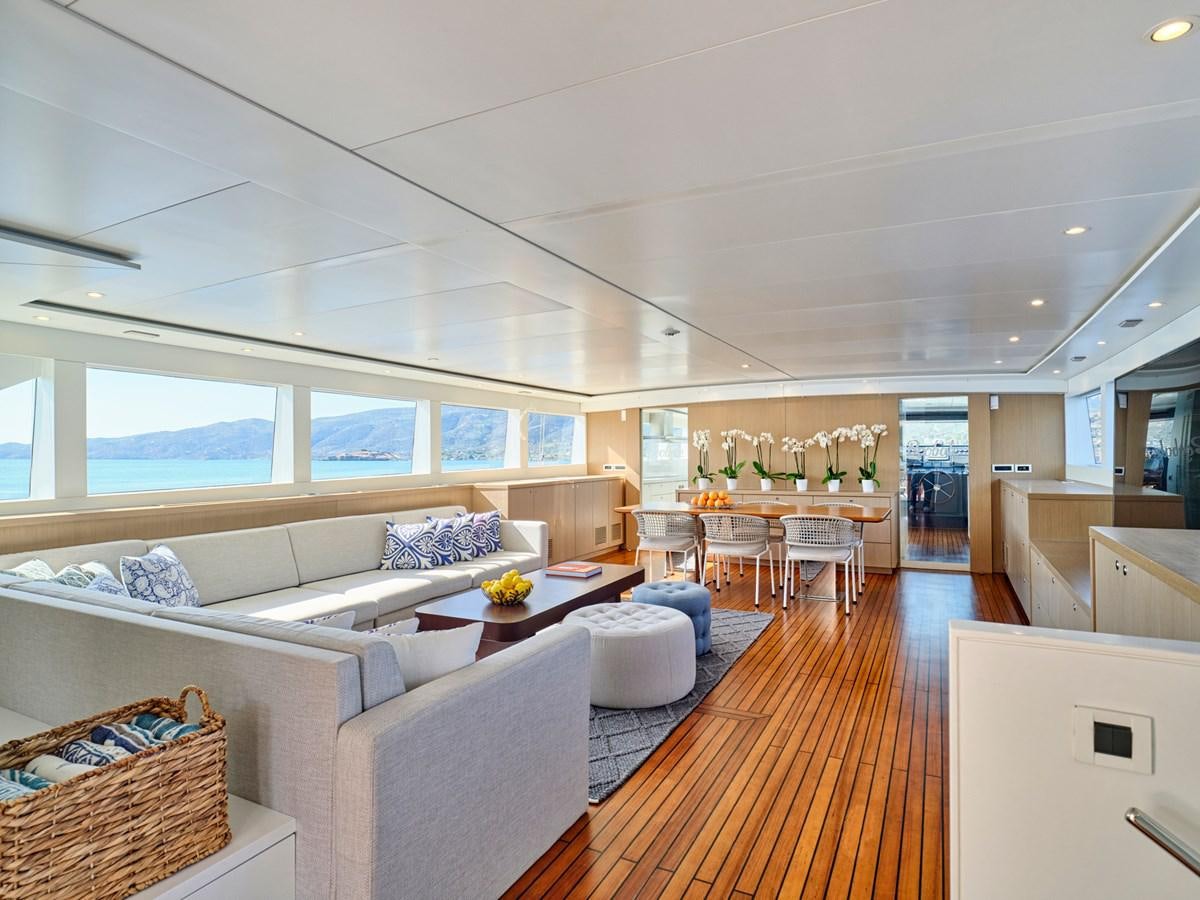 a living room with a large window aboard BOOBALE Yacht for Sale