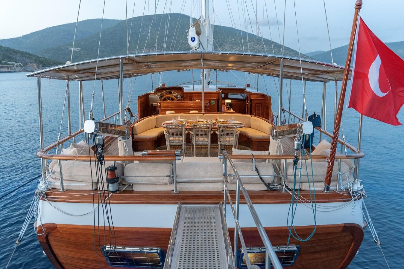 a boat with flags on it aboard L'ORIENT Yacht for Sale