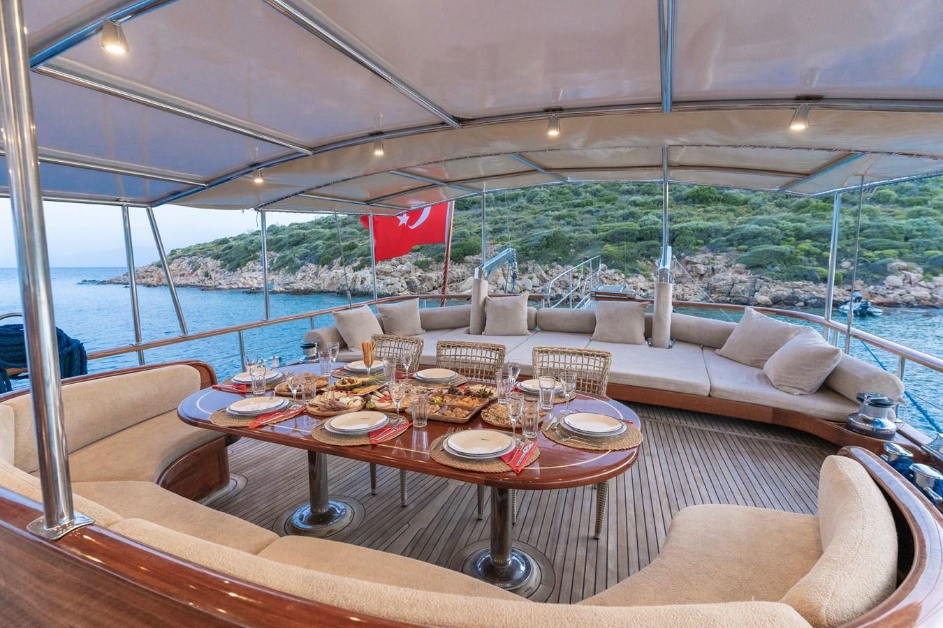 a table set for a meal aboard L'ORIENT Yacht for Sale