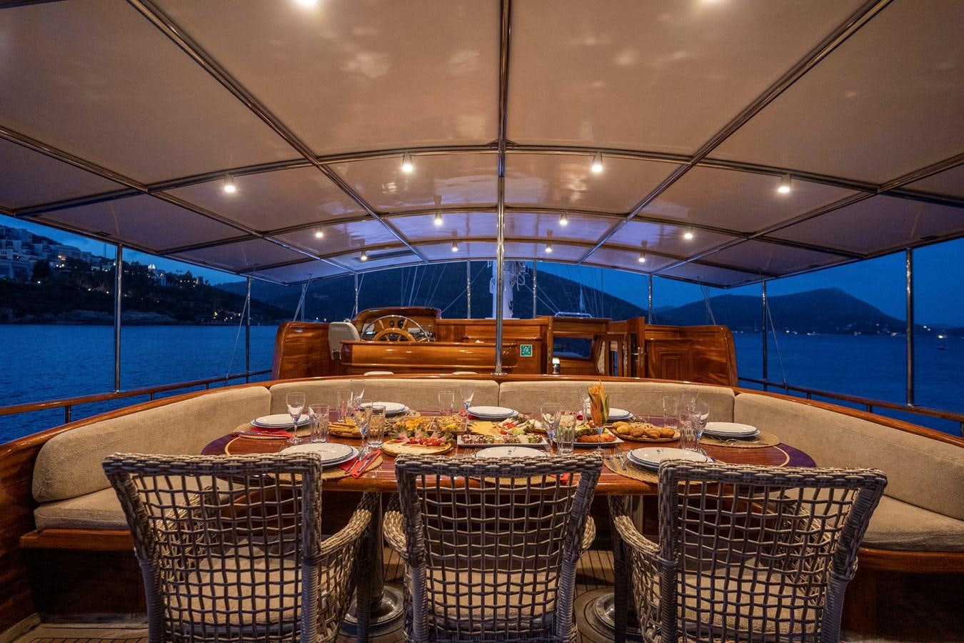 a table set for dinner aboard L'ORIENT Yacht for Sale