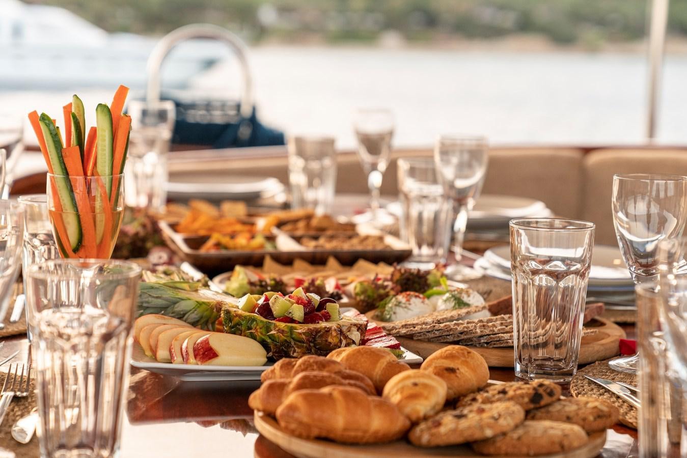 a table full of food aboard L'ORIENT Yacht for Sale