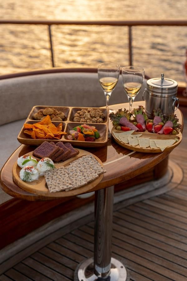 a table with food on it aboard L'ORIENT Yacht for Sale
