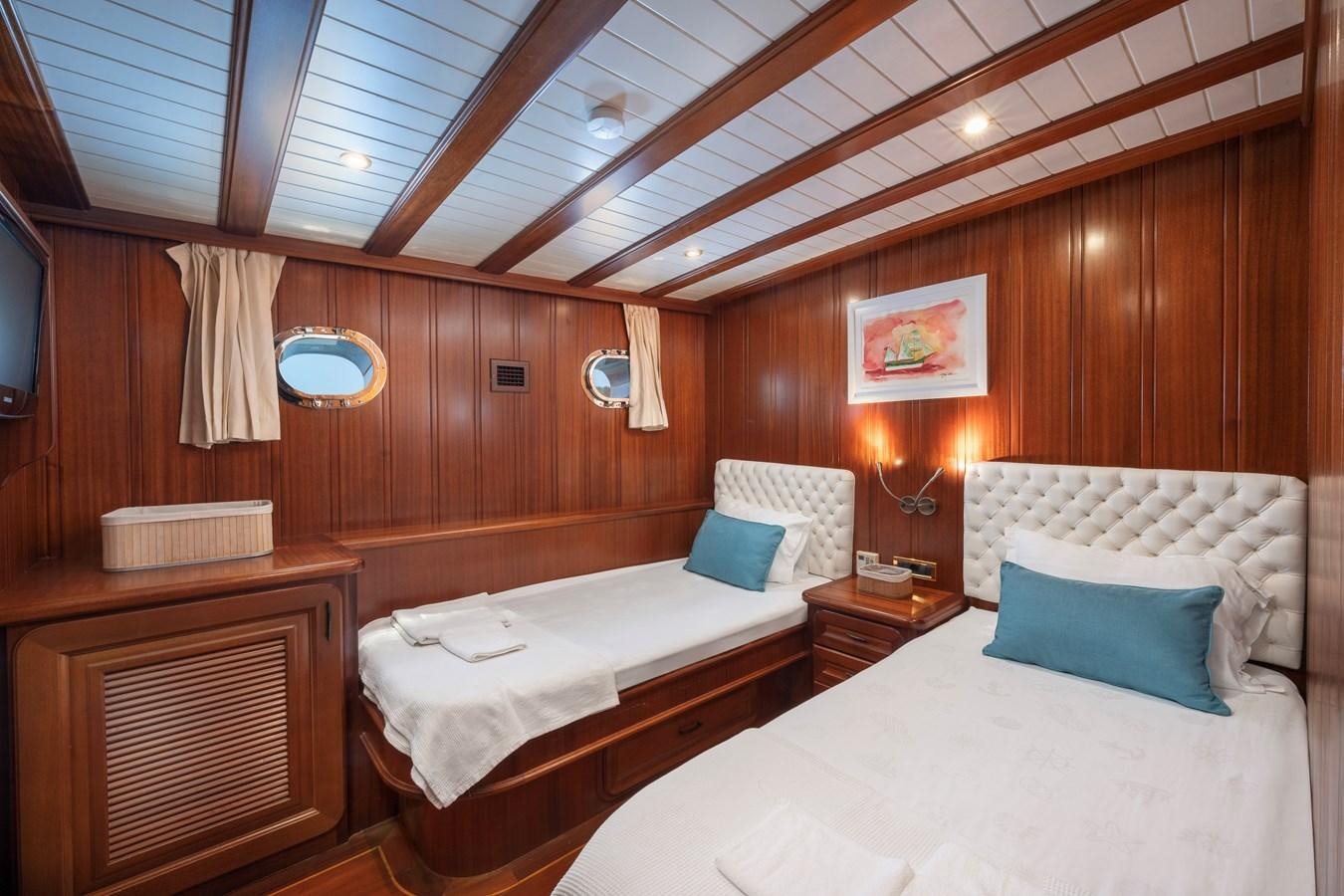 a room with two beds aboard L'ORIENT Yacht for Sale