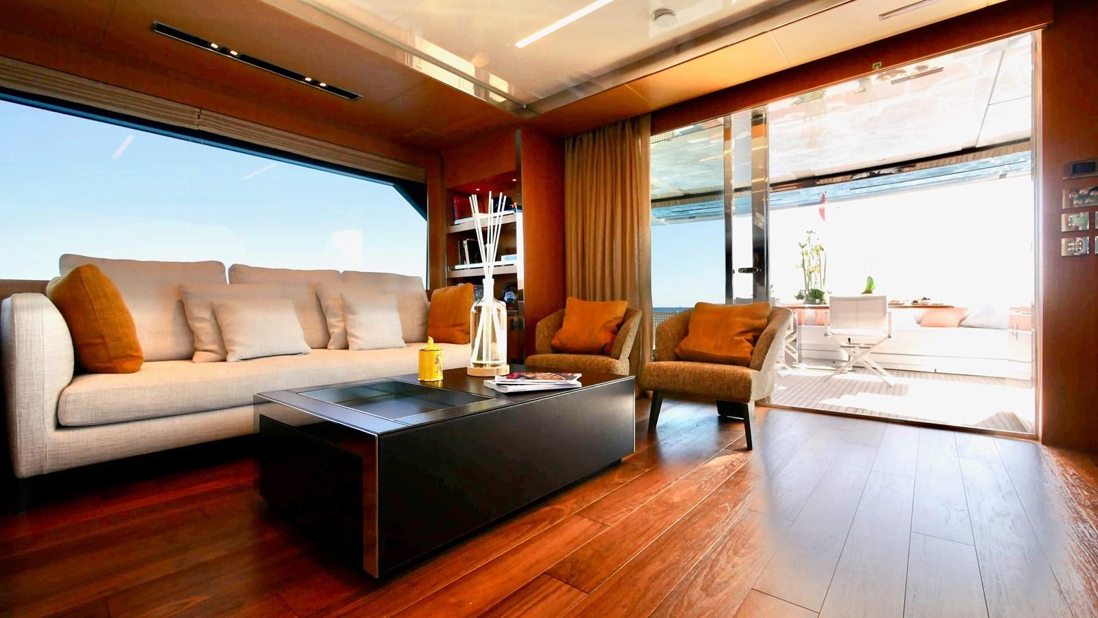 a living room with a large window aboard BASILIC Yacht for Sale