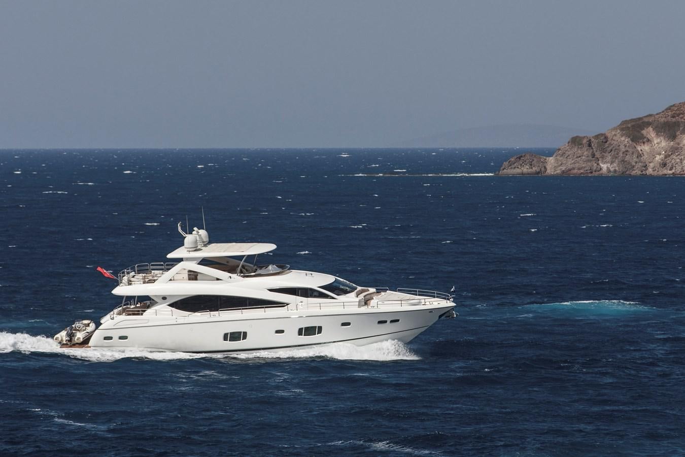 a white yacht in the water aboard SSM Yacht for Sale