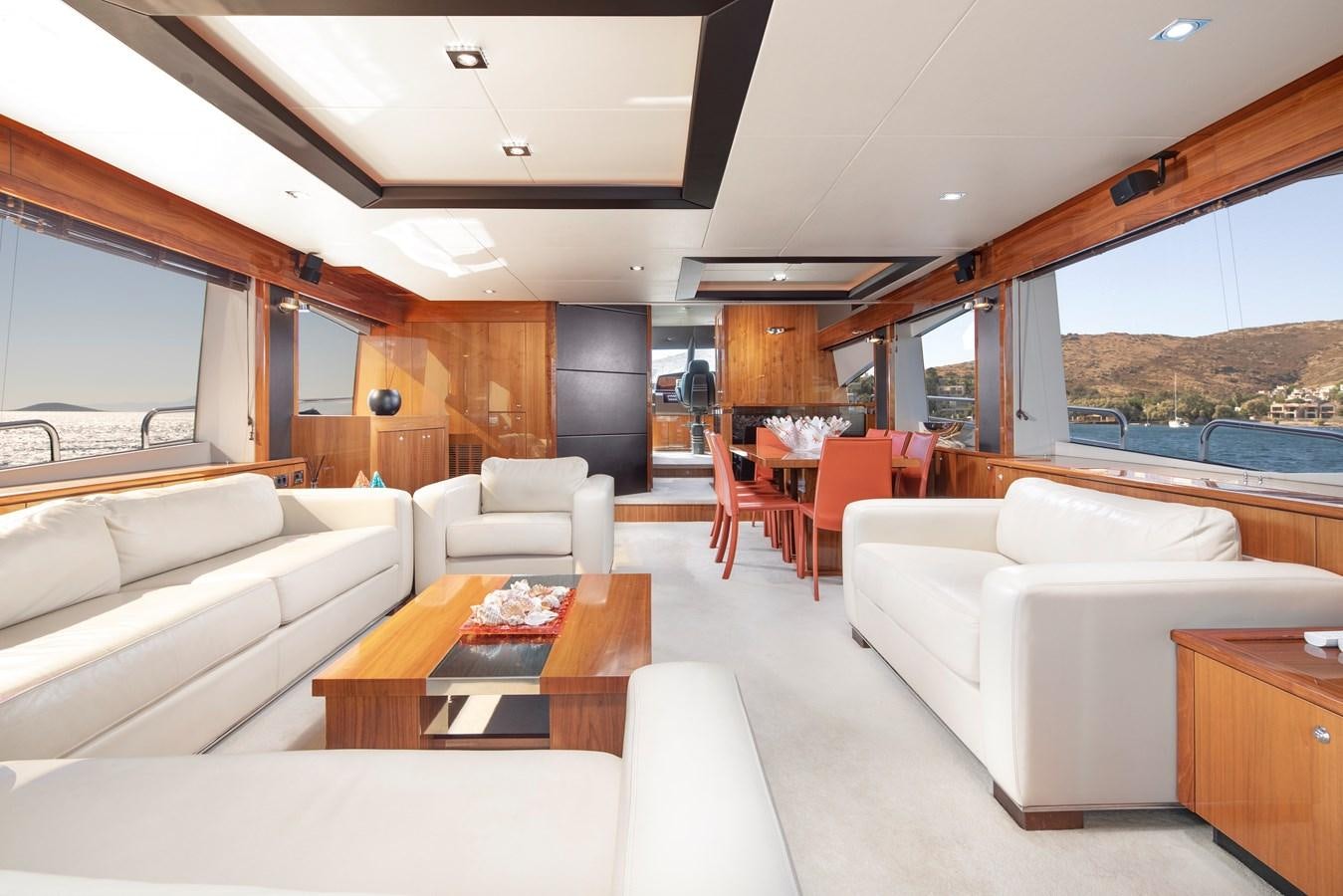 a living room with a large window aboard SSM Yacht for Sale