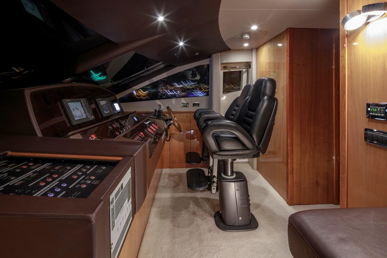 a room with a chair and a desk with a computer aboard SSM Yacht for Sale