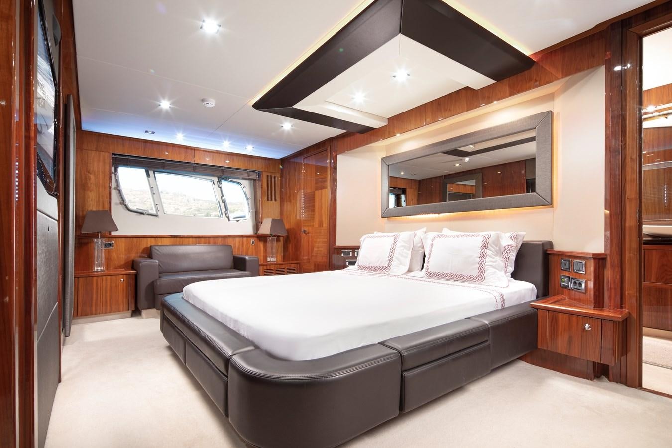 a large bedroom with a large bed aboard SSM Yacht for Sale