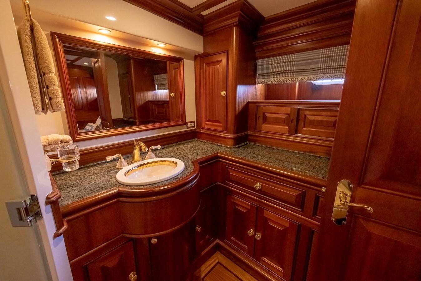 a bathroom with a sink and cabinets aboard 85 CLASSIC Yacht for Sale