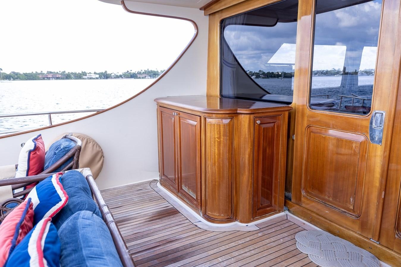 a cabin with a bed and a wood cabinet aboard 85 CLASSIC Yacht for Sale