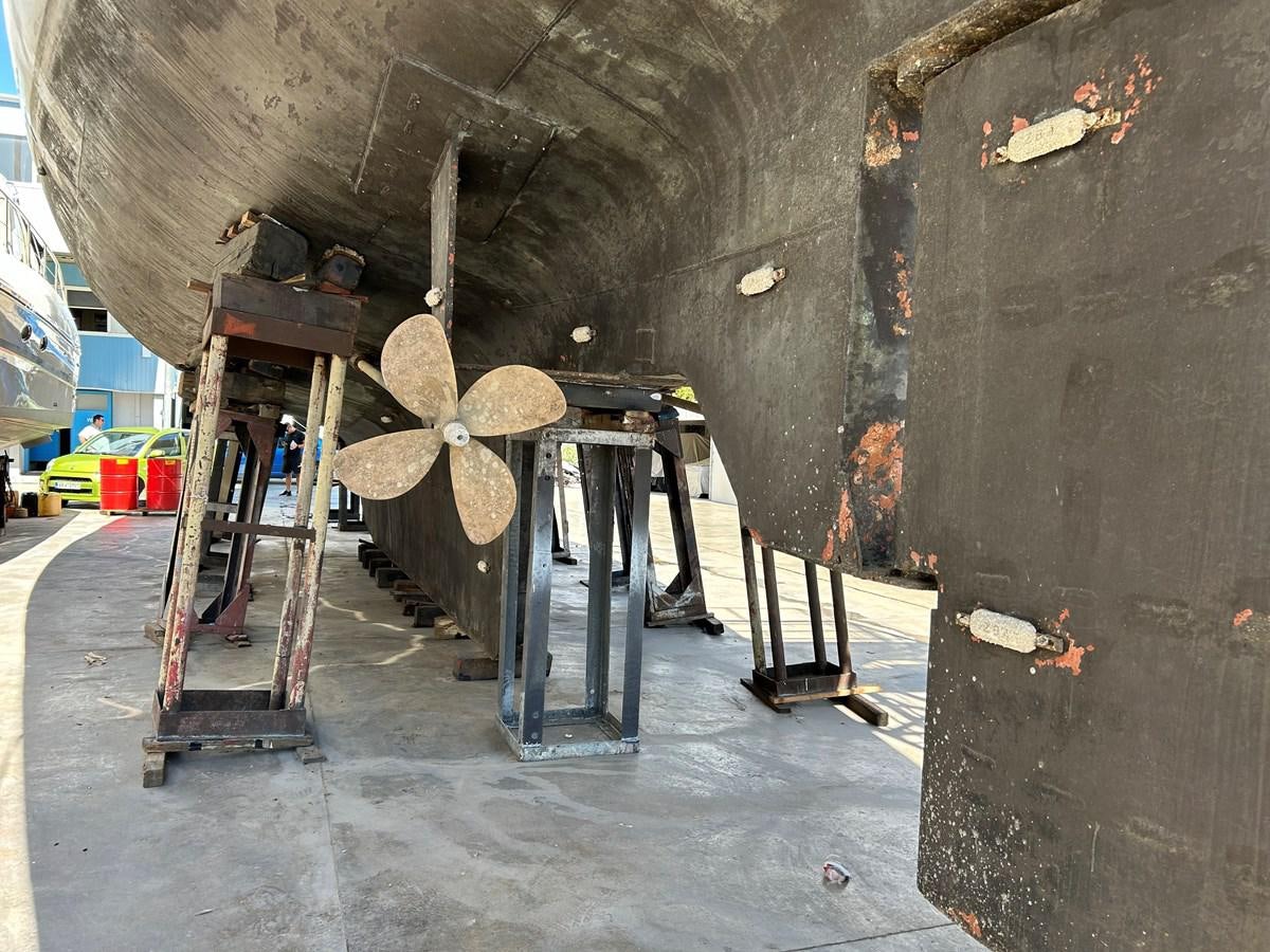 a room with a large fireplace aboard MOTORSAILLOR Yacht for Sale