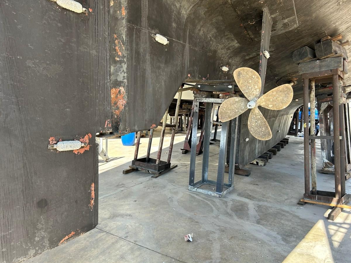 a room with a large butterfly sculpture aboard MOTORSAILLOR Yacht for Sale