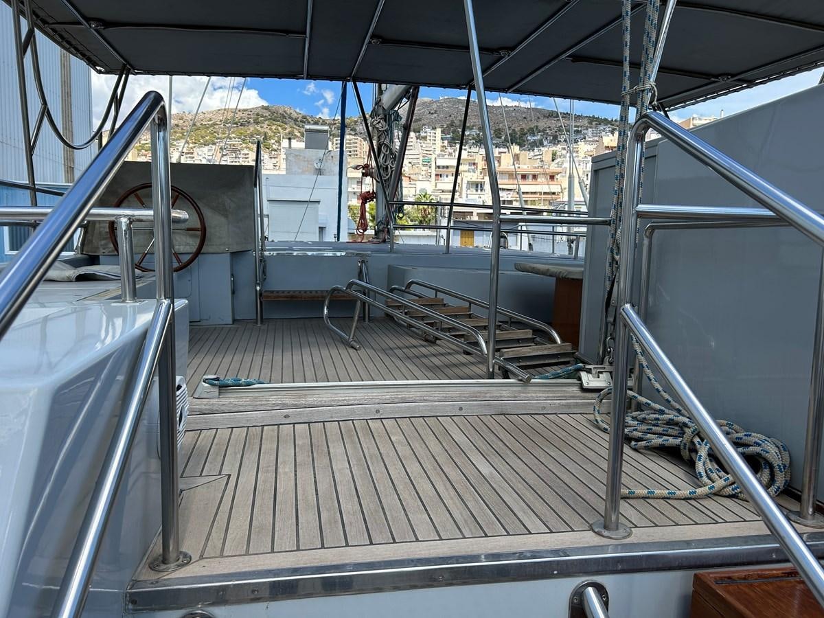 a deck with a deck and a railing aboard MOTORSAILLOR Yacht for Sale