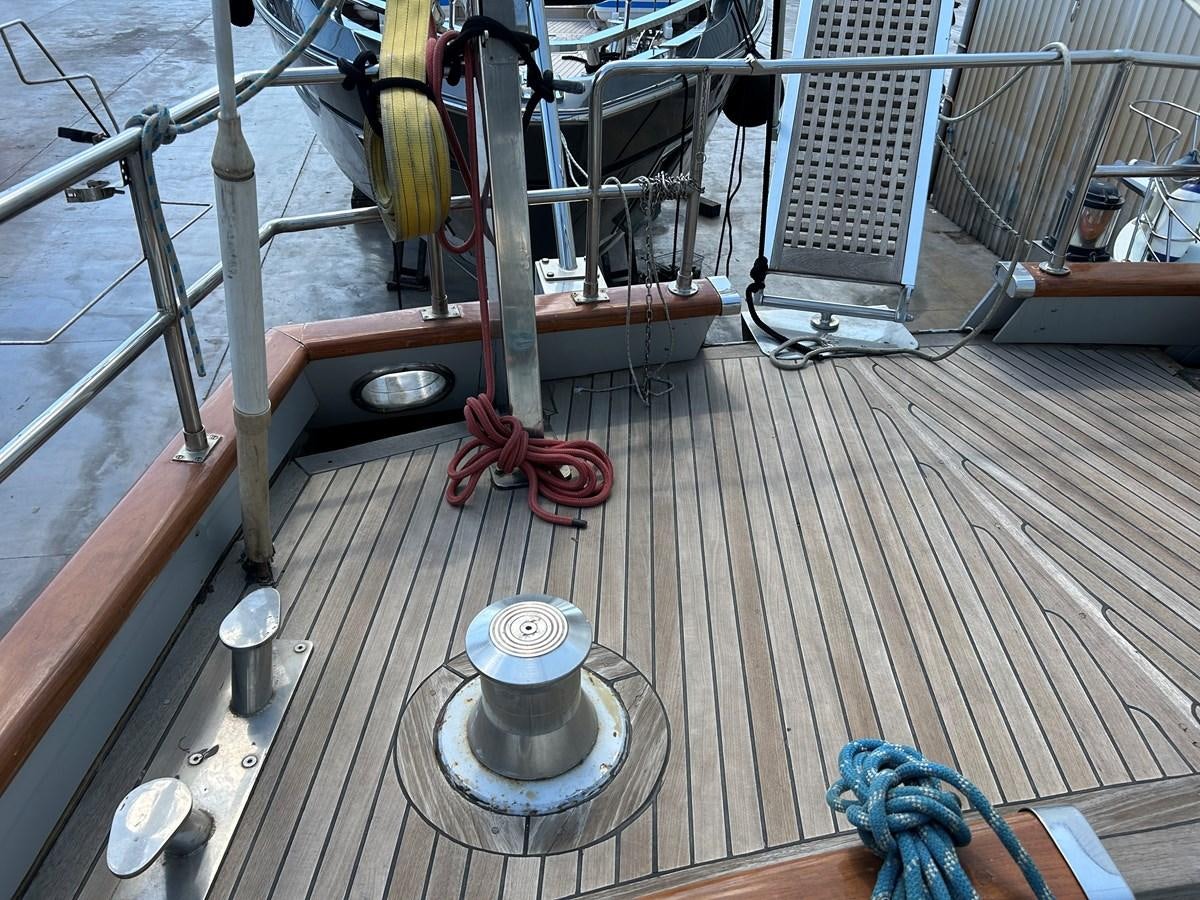 a metal object on a wooden surface aboard MOTORSAILLOR Yacht for Sale