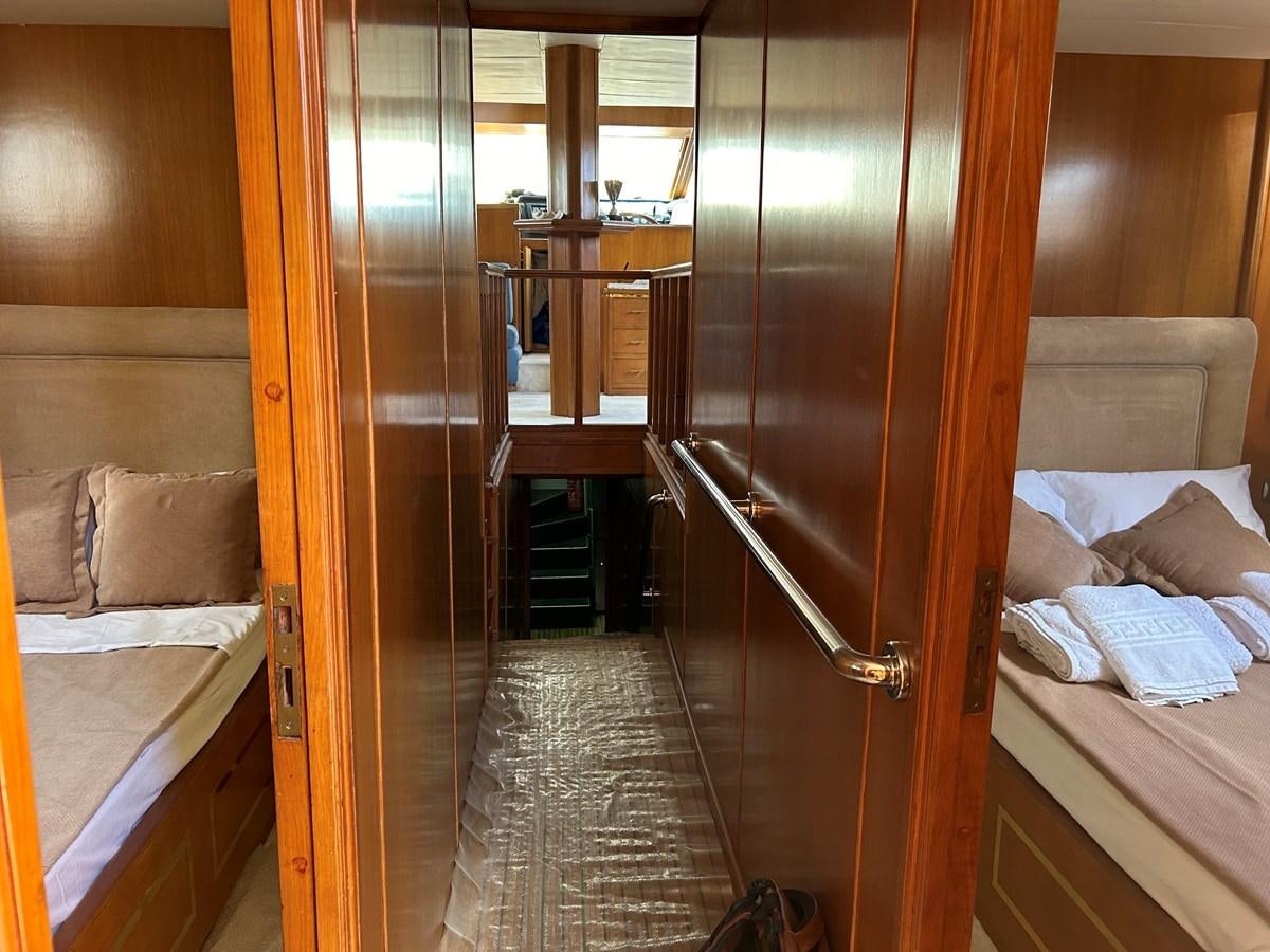 a room with a bed and a closet aboard MOTORSAILLOR Yacht for Sale