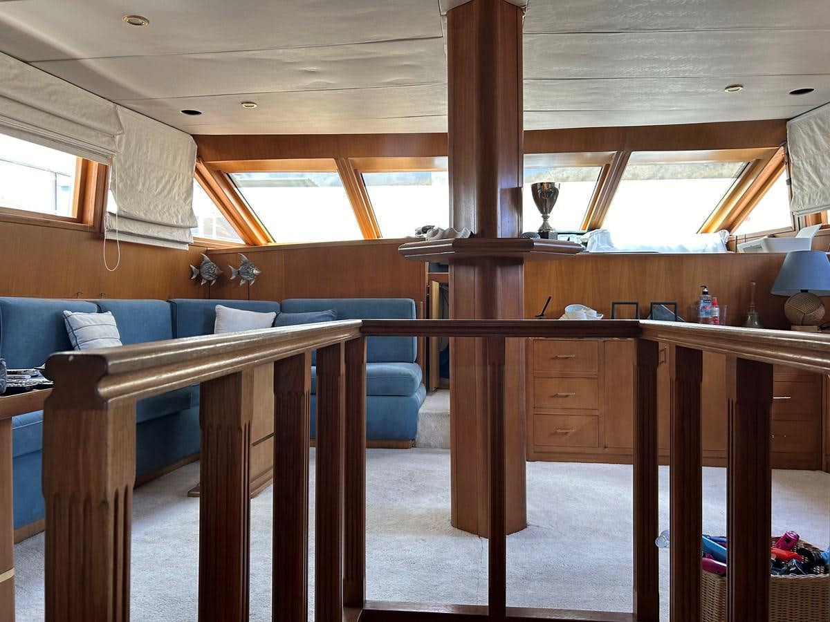 a room with a couch and a table aboard MOTORSAILLOR Yacht for Sale