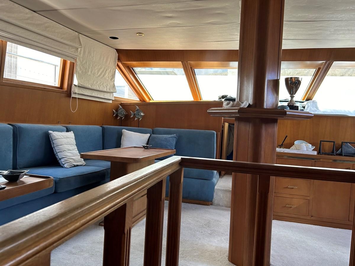 a room with a couch and a table aboard MOTORSAILLOR Yacht for Sale