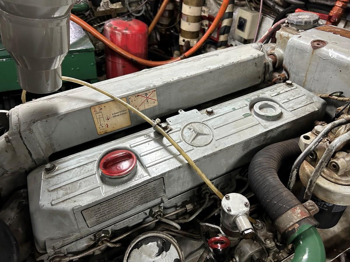 a car with a large piece of wood in the trunk aboard MOTORSAILLOR Yacht for Sale