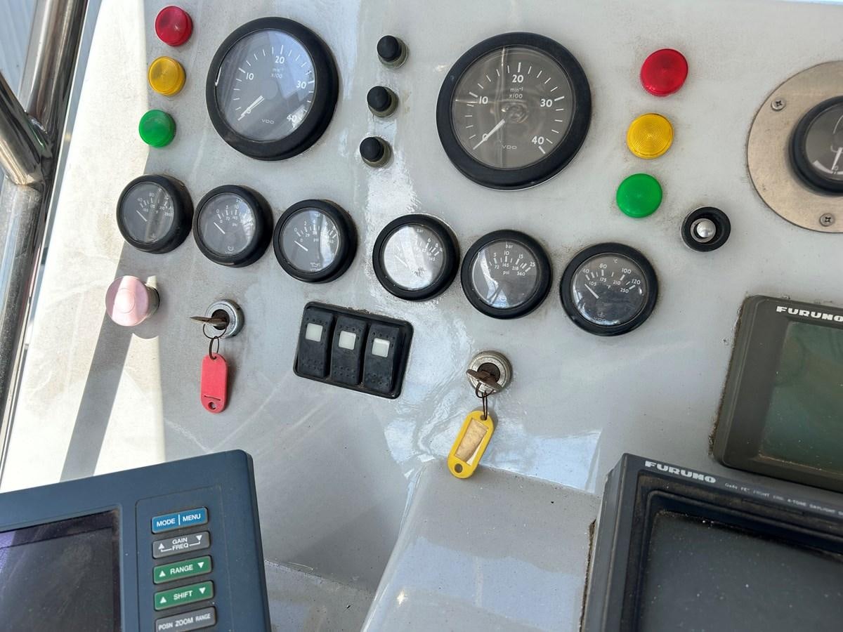 a group of buttons on a vehicle aboard MOTORSAILLOR Yacht for Sale