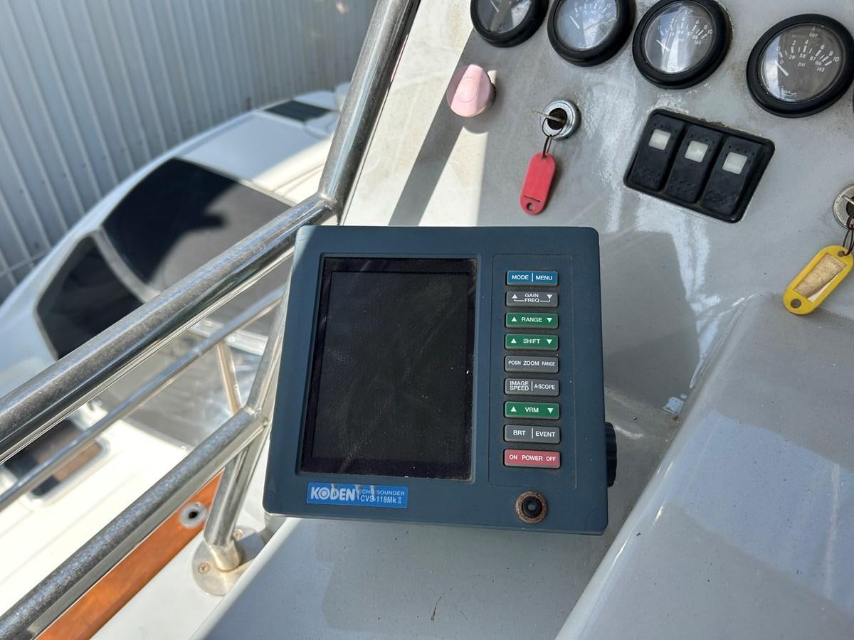 a small electronic device aboard MOTORSAILLOR Yacht for Sale