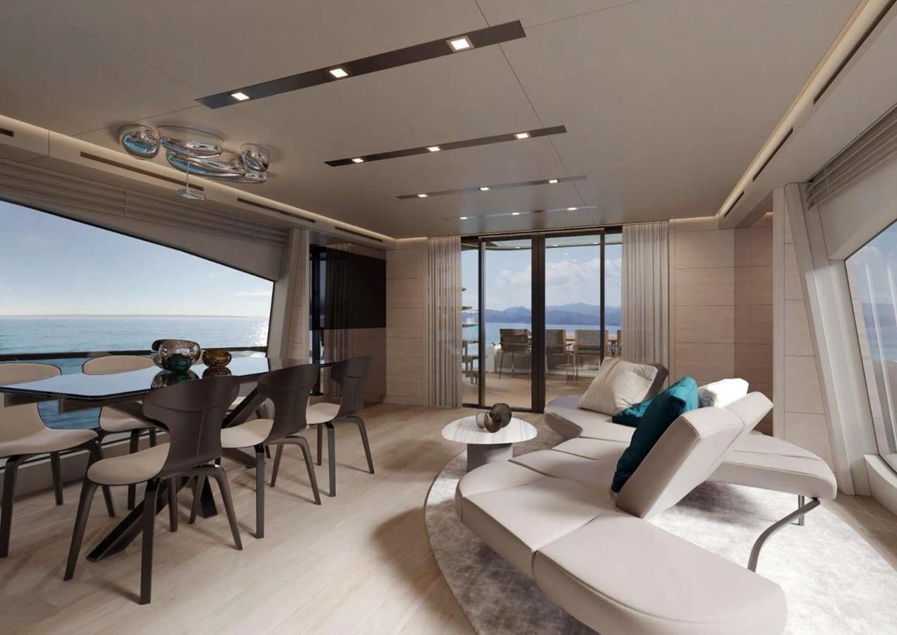 a living room with a large table and couches aboard AB80 Yacht for Sale