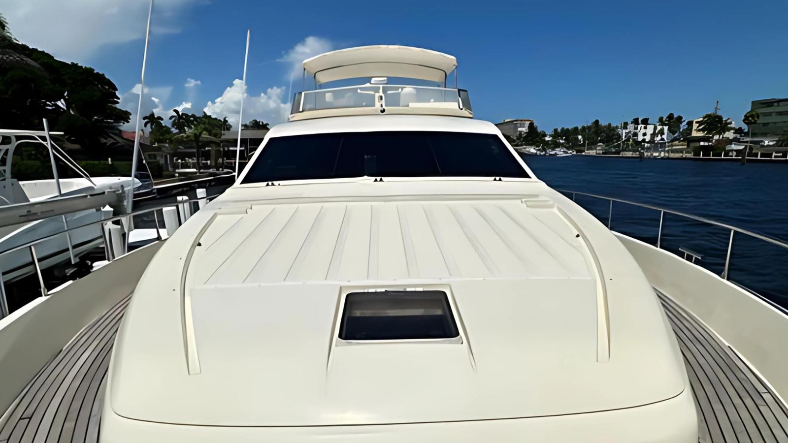 a white yacht on the water aboard 1998 FERRETTI 80FT Yacht for Sale