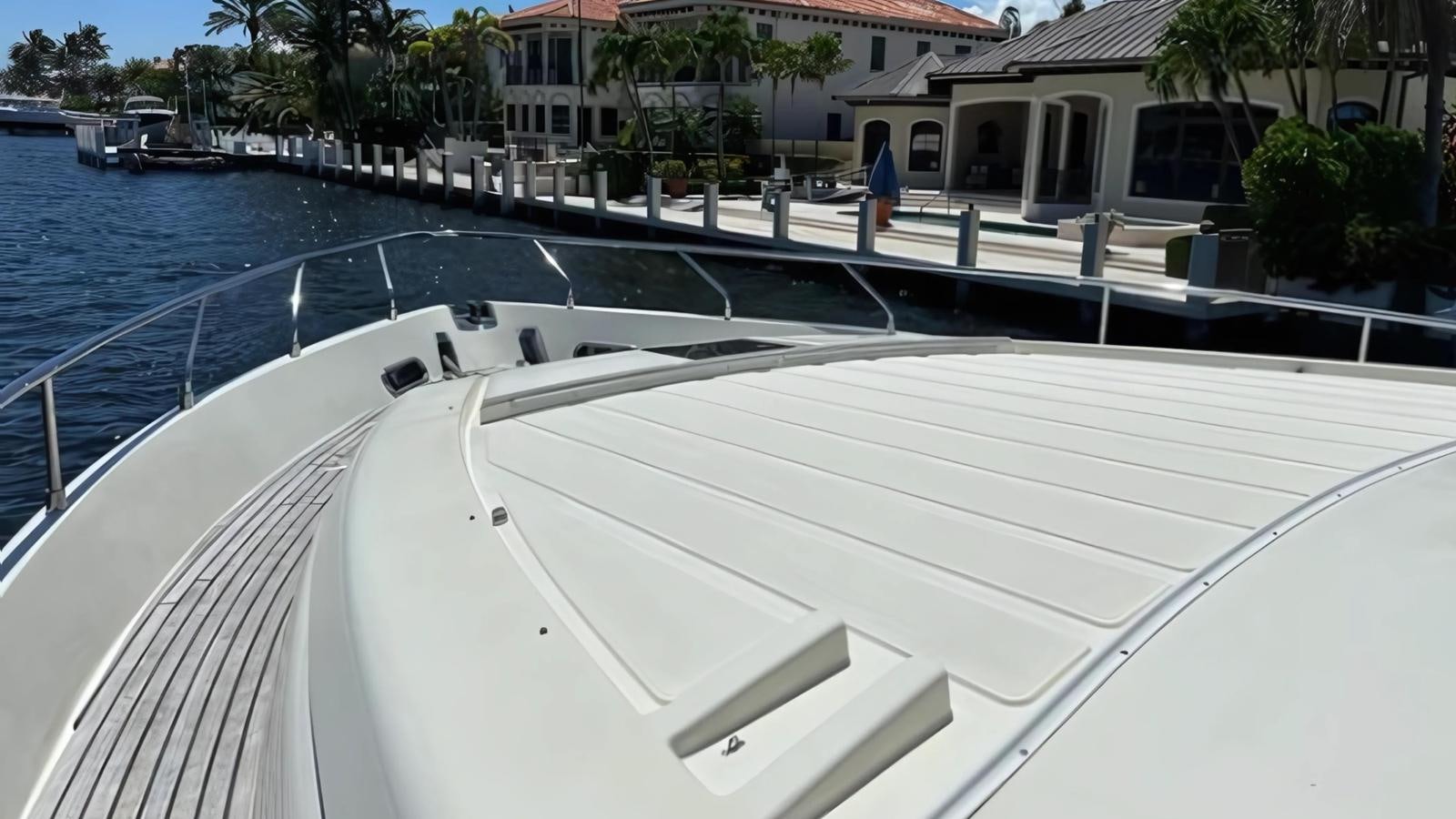 a white boat on the water aboard 1998 FERRETTI 80FT Yacht for Sale