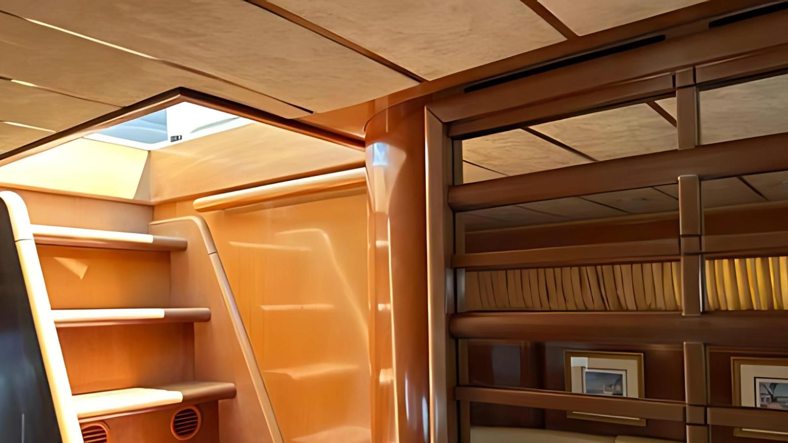 a room with wooden shelves aboard 1998 FERRETTI 80FT Yacht for Sale