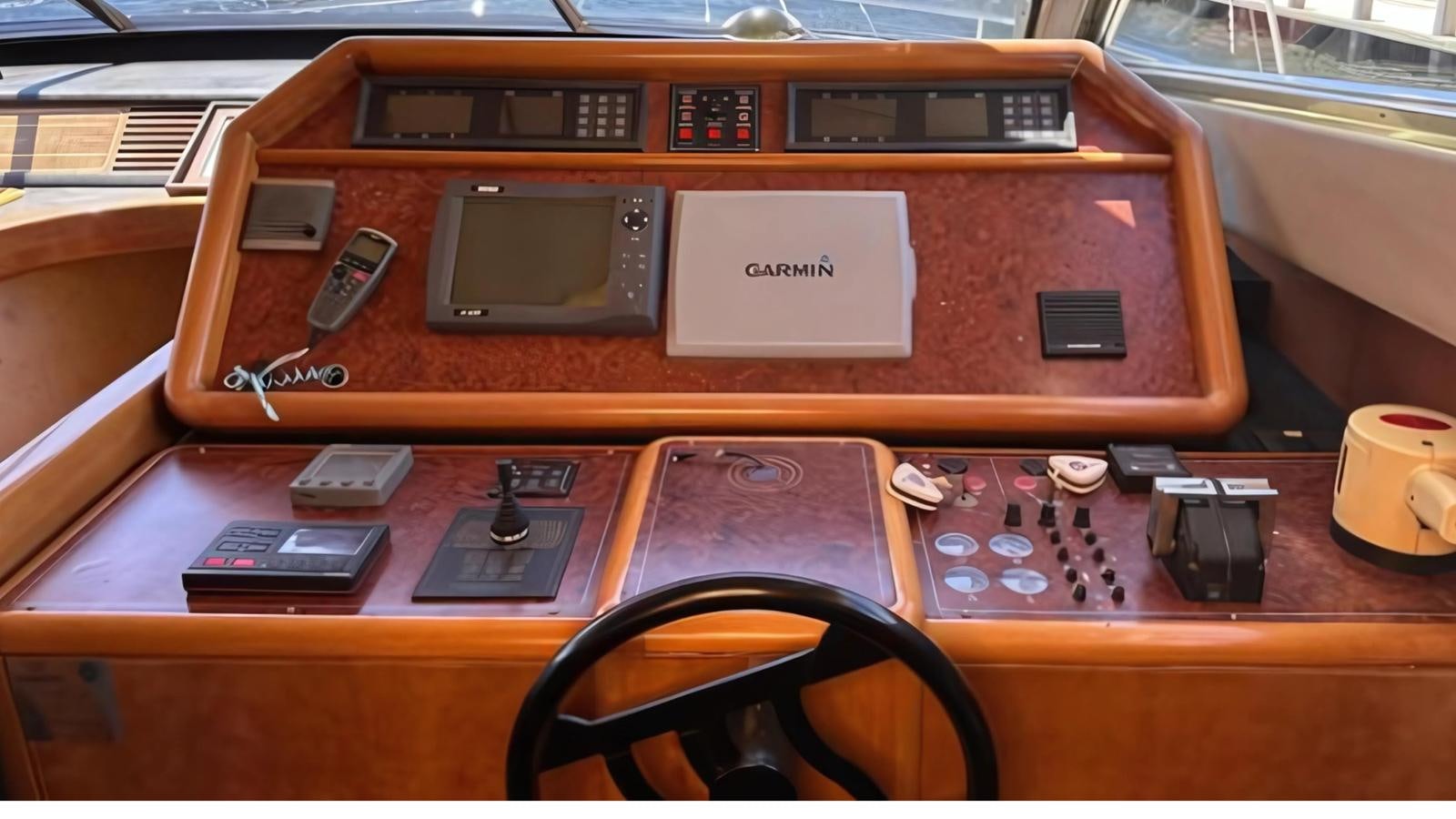 a wooden radio with dials and buttons aboard 1998 FERRETTI 80FT Yacht for Sale