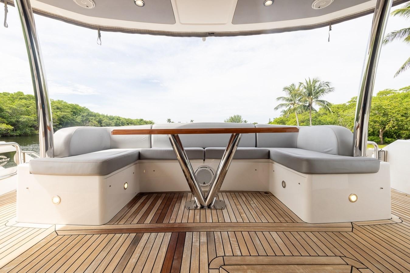 a deck with a view of the ocean and the land aboard 2018 SUNSEEKER 75 YACHT Yacht for Sale
