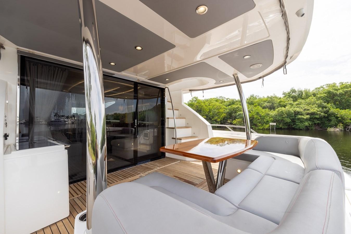 a room with a table and a couch aboard 2018 SUNSEEKER 75 YACHT Yacht for Sale