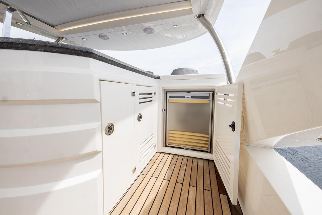 a room with a wood floor and a microwave oven aboard 2018 SUNSEEKER 75 YACHT Yacht for Sale