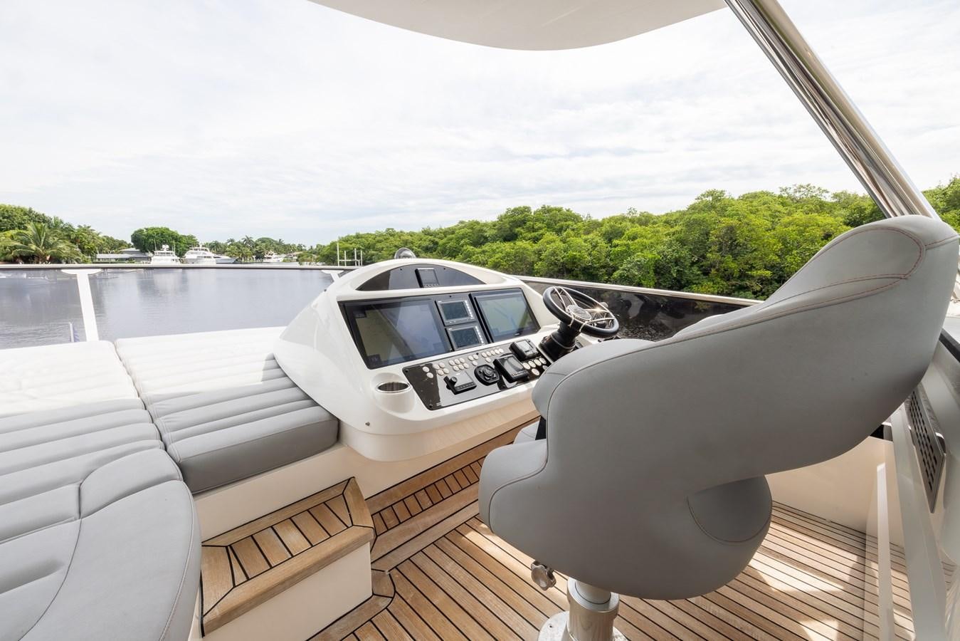a white car with a screen on the window aboard 2018 SUNSEEKER 75 YACHT Yacht for Sale