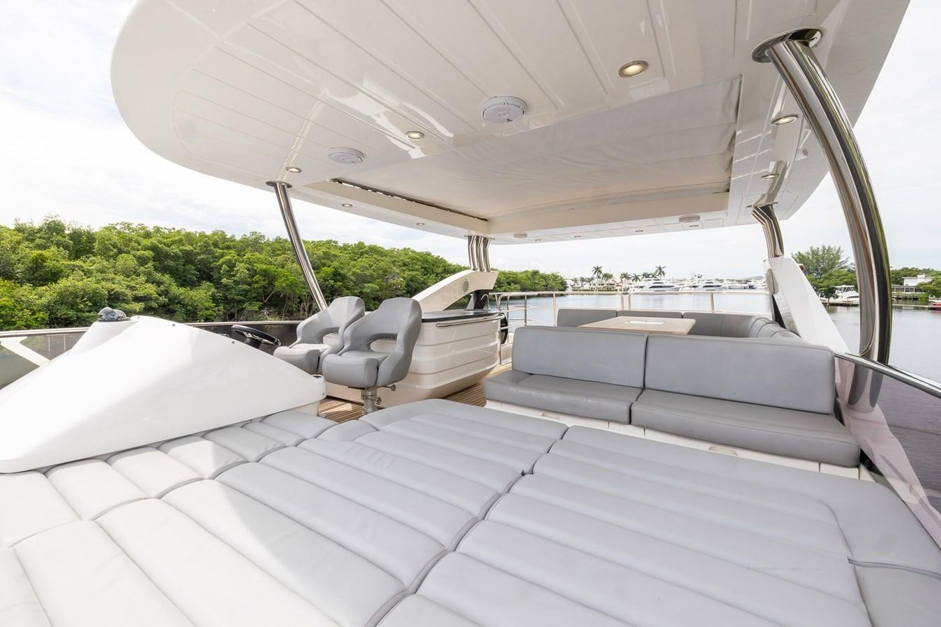 a white tent with chairs and a couch in it aboard 2018 SUNSEEKER 75 YACHT Yacht for Sale