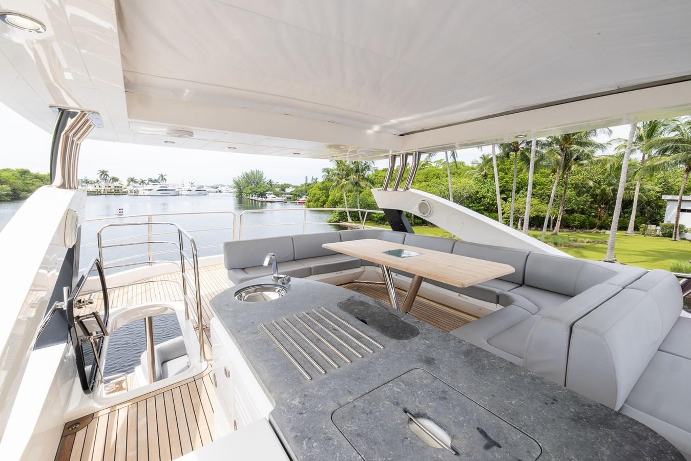 a large white tent with a pool and a picnic table aboard 2018 SUNSEEKER 75 YACHT Yacht for Sale