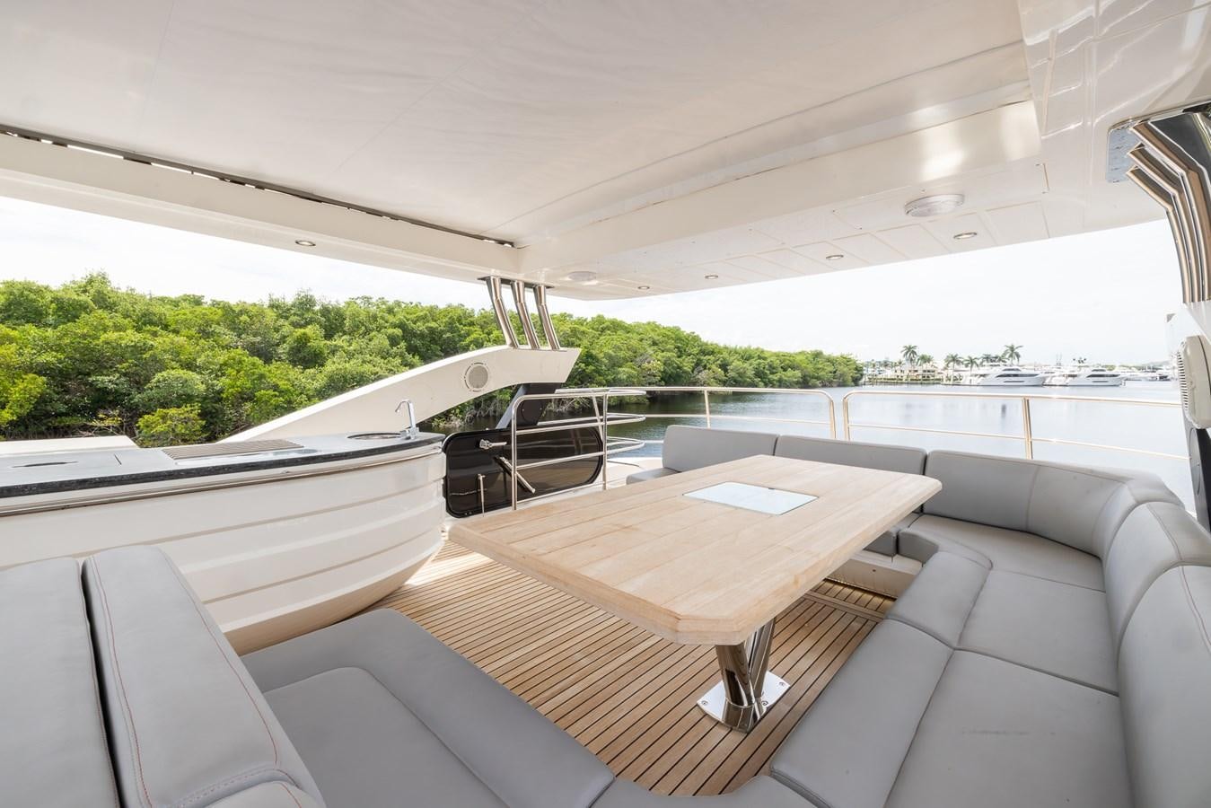 a room with a table and chairs aboard 2018 SUNSEEKER 75 YACHT Yacht for Sale