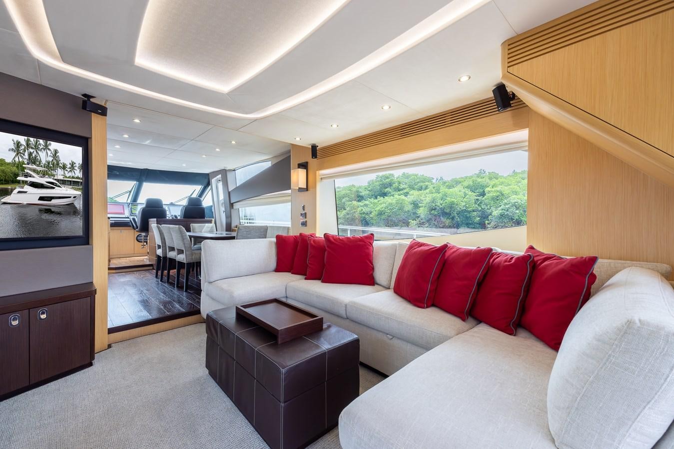 a living room with a couch and a tv aboard 2018 SUNSEEKER 75 YACHT Yacht for Sale