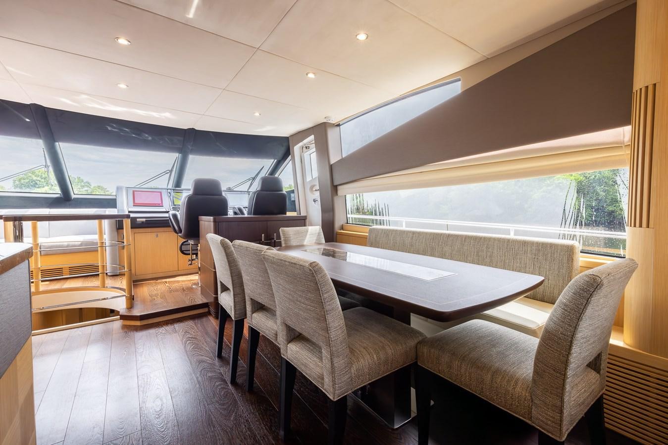 a room with a table and chairs aboard 2018 SUNSEEKER 75 YACHT Yacht for Sale