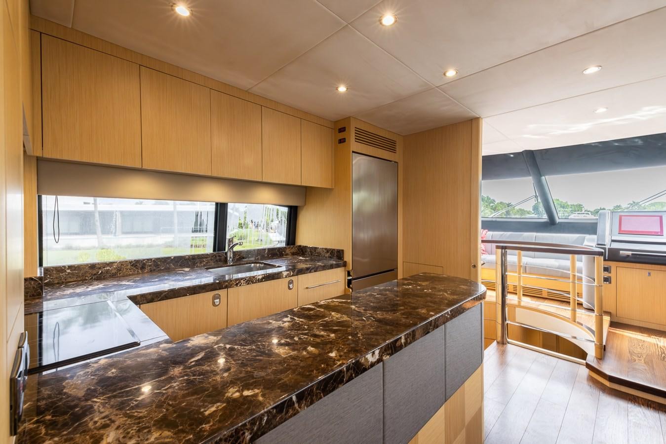 a large kitchen with marble counters aboard 2018 SUNSEEKER 75 YACHT Yacht for Sale