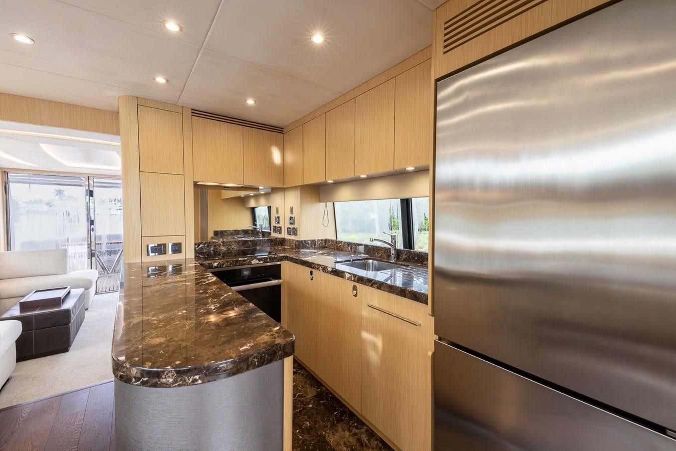 a kitchen with a large island aboard 2018 SUNSEEKER 75 YACHT Yacht for Sale