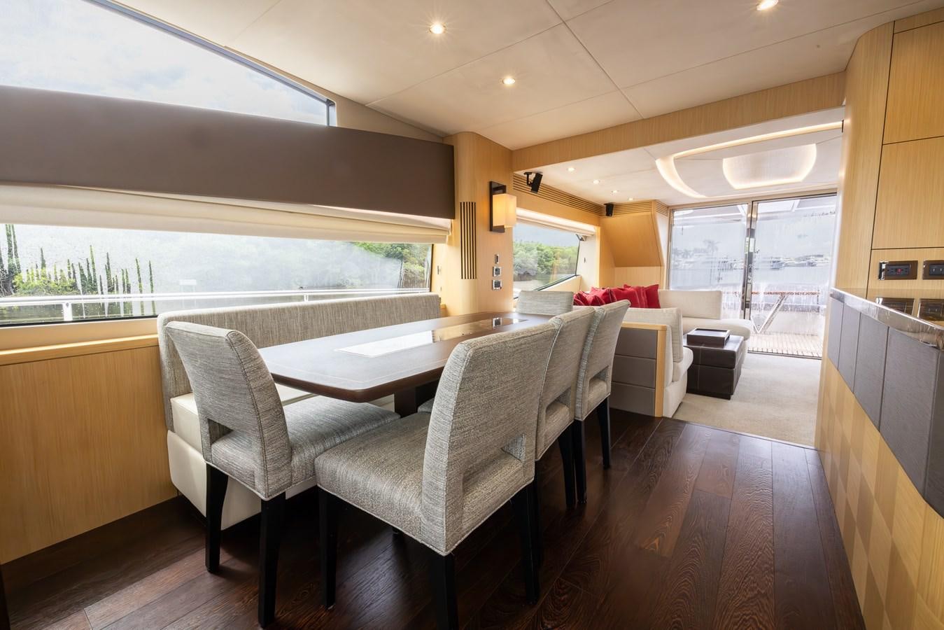 a dining room with a table and chairs aboard 2018 SUNSEEKER 75 YACHT Yacht for Sale