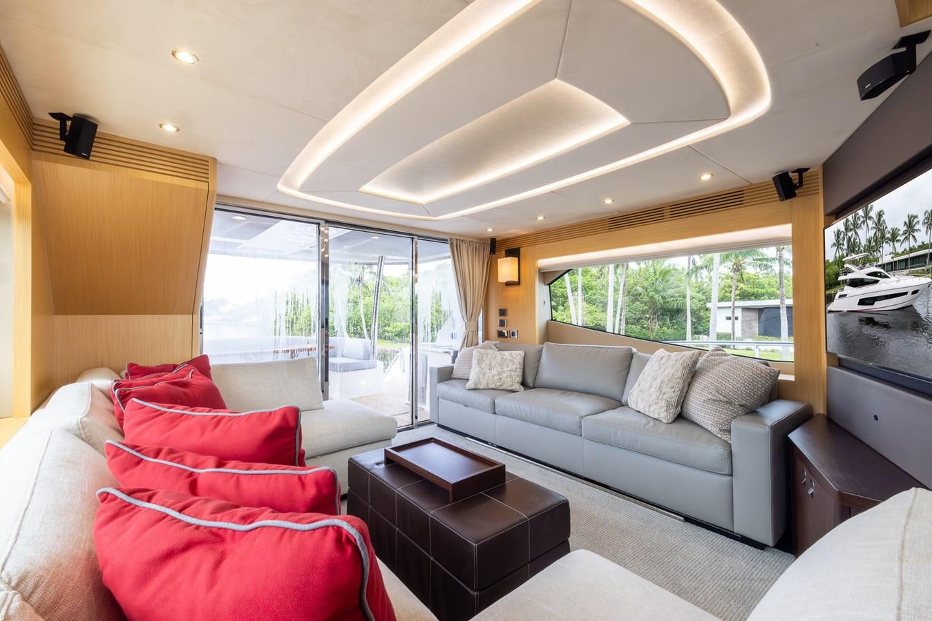 a living room with a large window aboard 2018 SUNSEEKER 75 YACHT Yacht for Sale