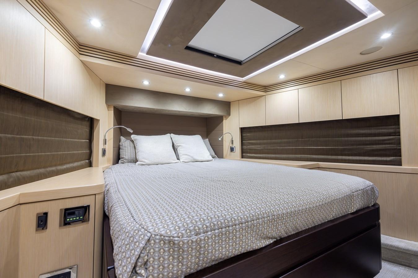 a room with a bed and a wood wall aboard 2018 SUNSEEKER 75 YACHT Yacht for Sale