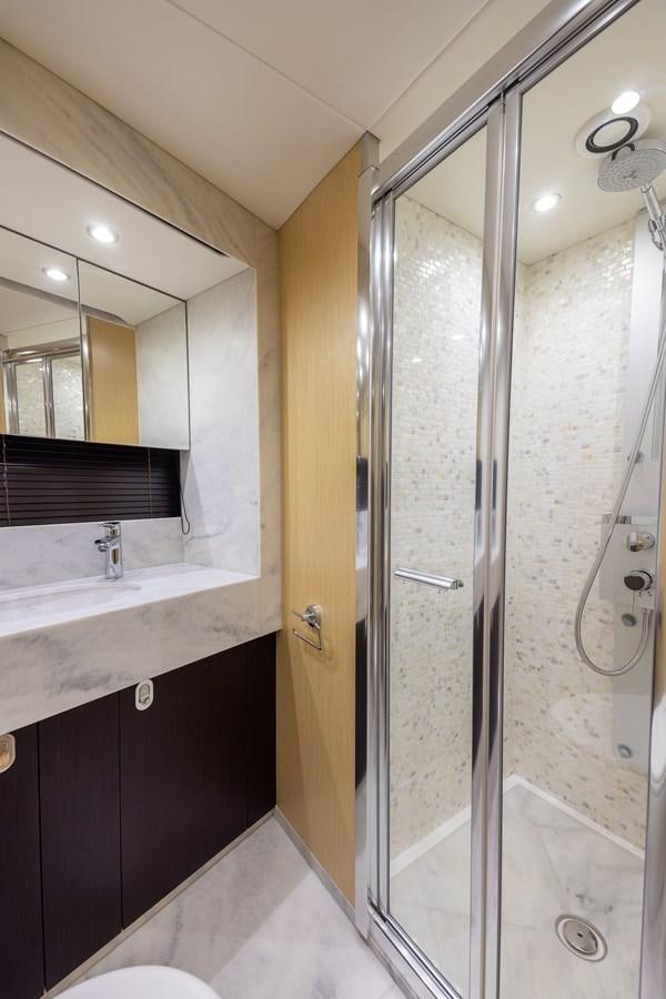 a bathroom with a shower unit and sink aboard 2018 SUNSEEKER 75 YACHT Yacht for Sale
