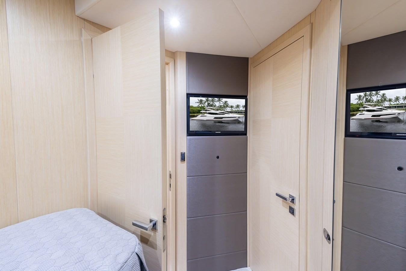 a room with a bed and a closet aboard 2018 SUNSEEKER 75 YACHT Yacht for Sale