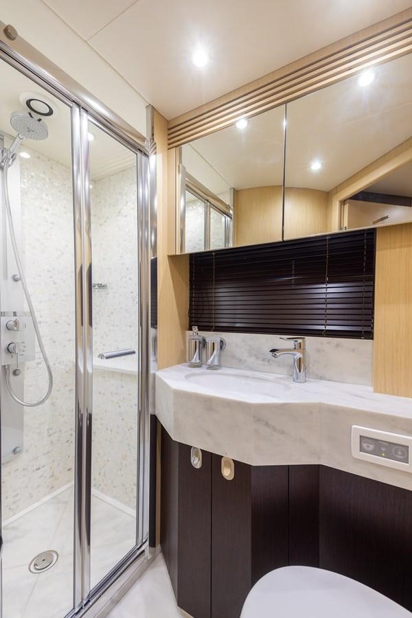 a bathroom with a shower unit and sink aboard 2018 SUNSEEKER 75 YACHT Yacht for Sale