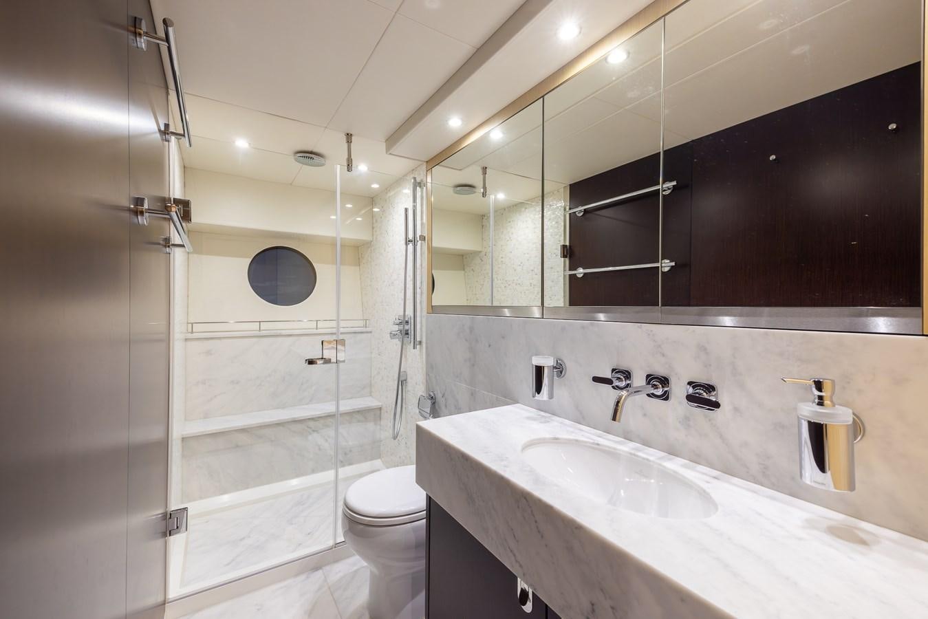 a bathroom with a sink toilet and bathtub aboard 2018 SUNSEEKER 75 YACHT Yacht for Sale