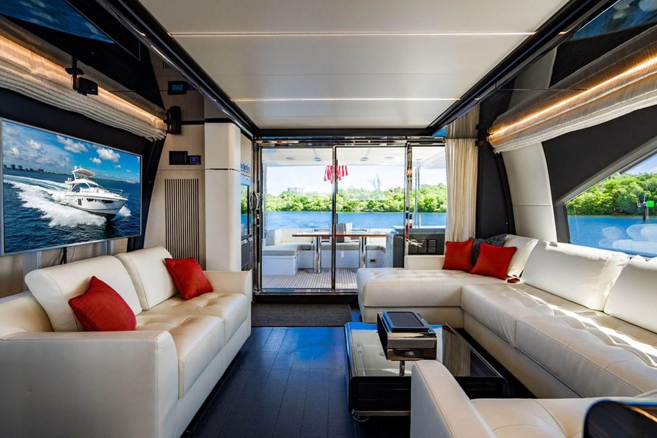 a room with a couch and a television aboard THE PERFECT MERITAGE Yacht for Sale